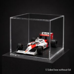 Scale Formula 1 car model in a clear, five-sided display case without a lid on a black pedestal.